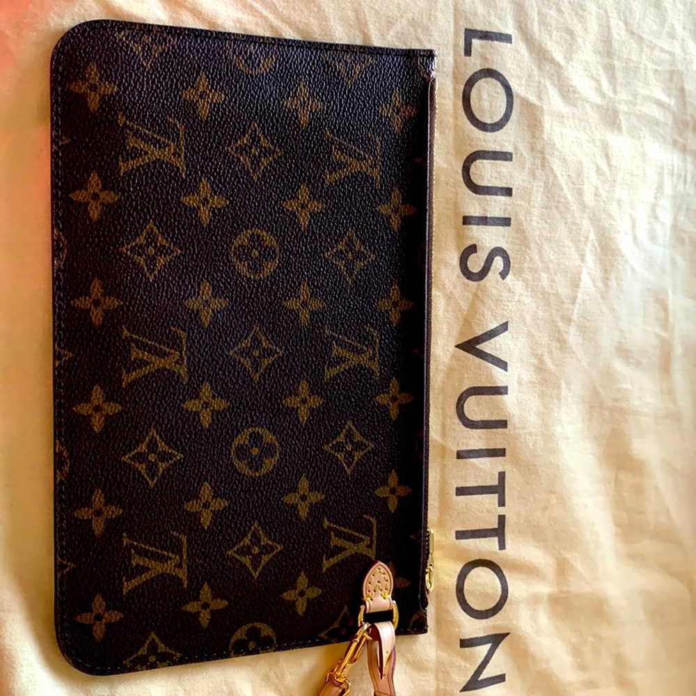 Louis Vuitton wristlet - in brand new condition.  No markings or imperfections.